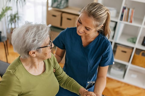 Elderly woman with a nurse