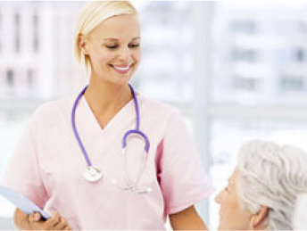 Nurse together with an elderly woman